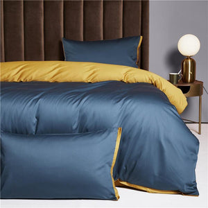 Ava Reversible Duvet Cover Set in yale and ochre colors.
