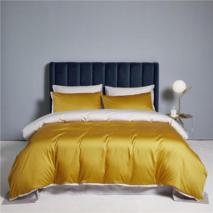 Ava Reversible Duvet Cover Set made of Egyptian Cotton in Ochre and Warm White color.