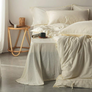 Demonstration of flat bedding sheets of Emma Duvet Cover Set made of cotton and linen in cream color.