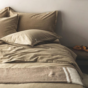 Pillow covers and bedding sheets from Emma Duvet Cover Set made of cotton and linen in Biscotti color.