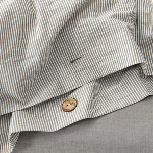 Close up of button that belongs to Olivia bedding set.
