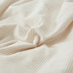 Stripe bed sheets in cream color.