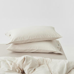 Two cream color pillow covers