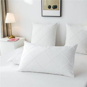 Pillow covers made of microfiber in white color.
