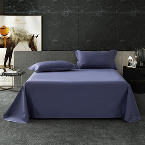 Blue bed sheets with two bedside tables and a horse picture in the back.