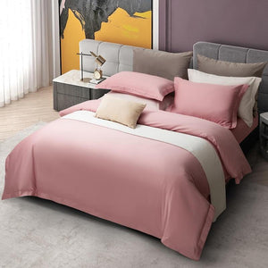 Beautiful Pink Juan 4 pcs Duvet Cover Set with an abstract picture in the back and two bedside tables with a clock and a lamp. 