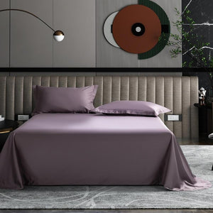 Abstract wall covers with a bed dressed with stretched purple bed sheets and two purple pillows.