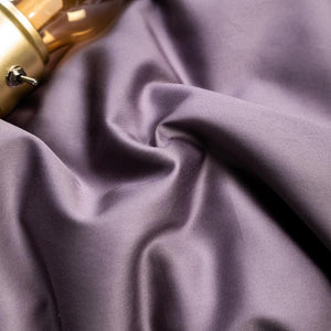 Purple bedding sheets.