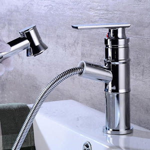 Pulling out the hose of Langfoss Bathroom Faucet in chrome color.